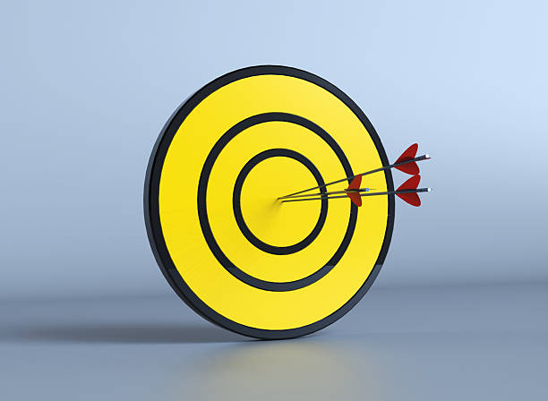 istock Arrow hitting target Black yellow leadership aiming achievement goal target 2208699739