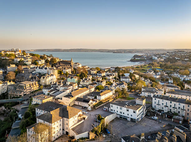 istock Setting sun over Torquay town centre to sea view 2208699993