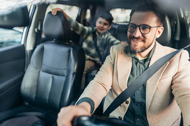 istock Father and son enjoying a car ride together 2208700189