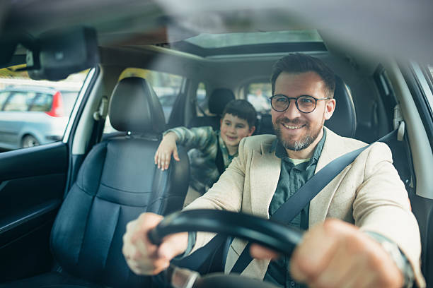istock Father and son enjoying a car ride together 2208700197