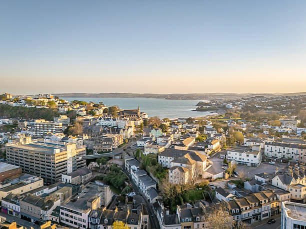 istock Setting sun over Torquay town centre to sea view 2208700215