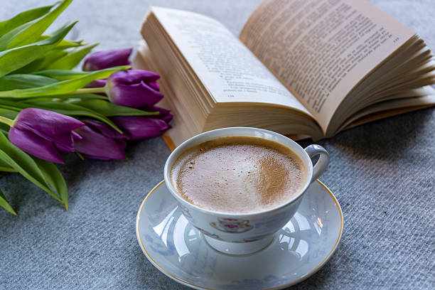 istock Relaxing and peaceful moment with a book and coffee. 2208706150