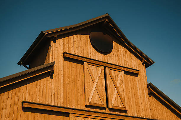 istock The Elegant and Exquisite Rustic Barn Architecture Set Against a Brilliantly Clear Blue Sky 2208711924