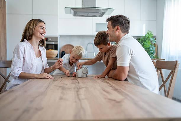 istock Family learning saving money together at home 2208715299