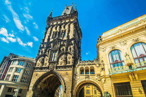 Historic Gothic Powder Tower in Prague captured from a frontal angle showcasing its detailed medieval architecture and towering presence in the old town skyline of the Czech capital