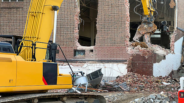 istock Demolition Excavator Claw Demolishing a Brick Building 2208721989