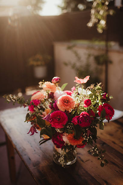 Elegant flower arrangement bouquet outdoors at sunset wedding