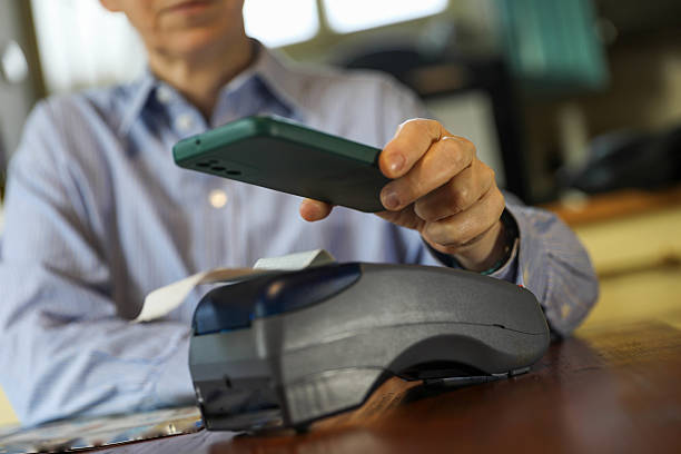 istock Contactless Mobile Payment with Smartphone at POS Terminal 2208722992