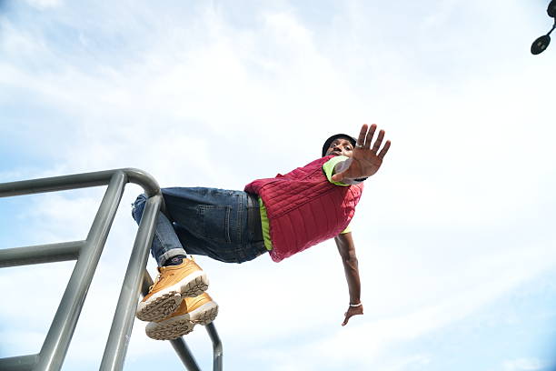 istock A young man poses on a metal railing 2208723173