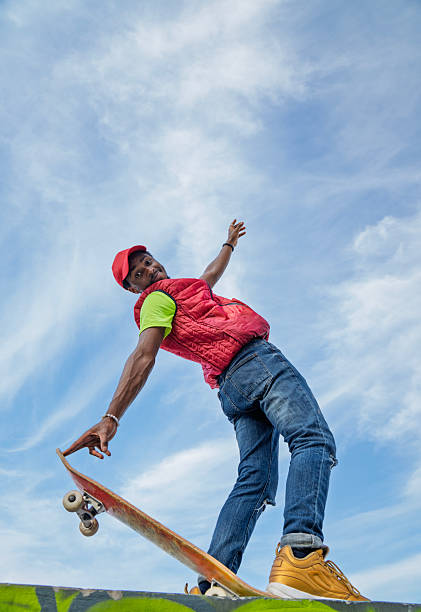 istock Happy young man with longboard and skateboard. 2208723214