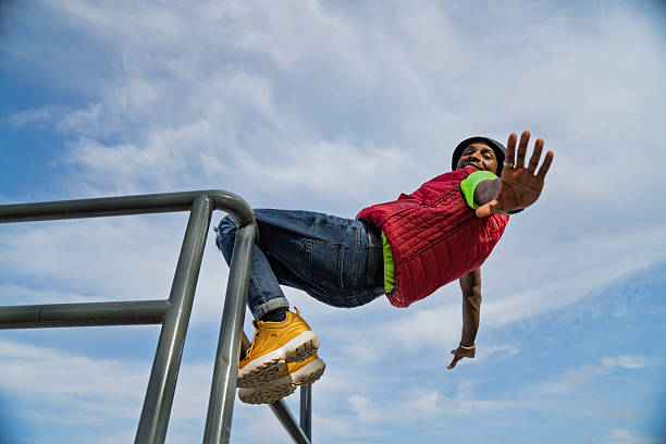 istock A young man poses on a metal railing 2208723231