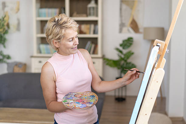 istock Artist at Work with Palette and Brush Creating Beautiful Art 2208725392