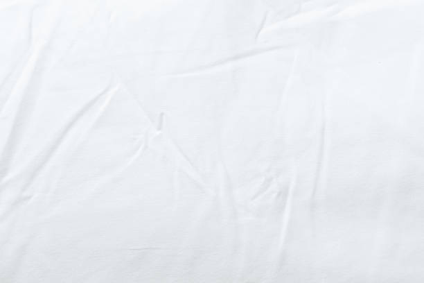 istock White bedsheet background, bed sheet texture, wrinkled duvet, crumpled satin blanket comforter cloth used in hotel, resort or home interior for bedding sleep comfort 2208725452