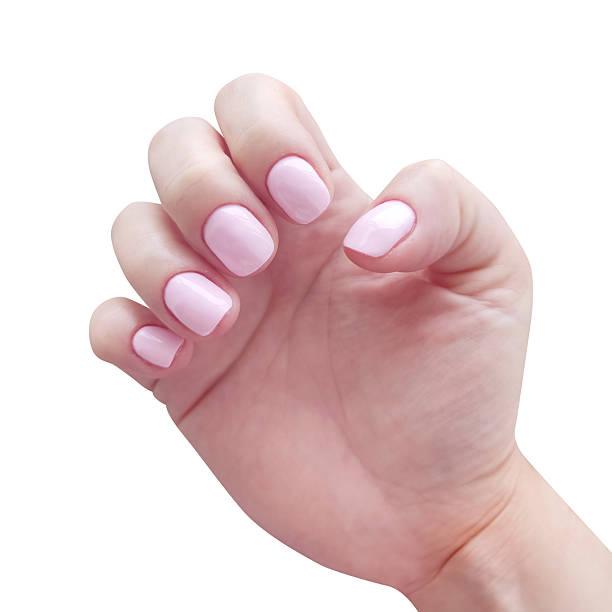 istock A hand showcases a light pink manicure, symbolizing beauty, selfcare, and elegance. Ideal for cosmetic advertising, nail art tutorials, or wellness promotions. 2208726105