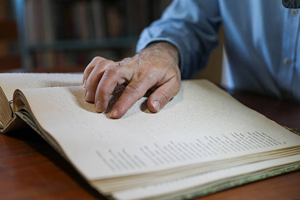 istock A Blind Man Over 50 Reading Braille Book 2208726131