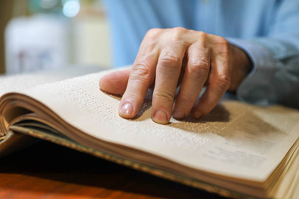 istock A Blind Man Over 50 Reading Braille Book 2208726255