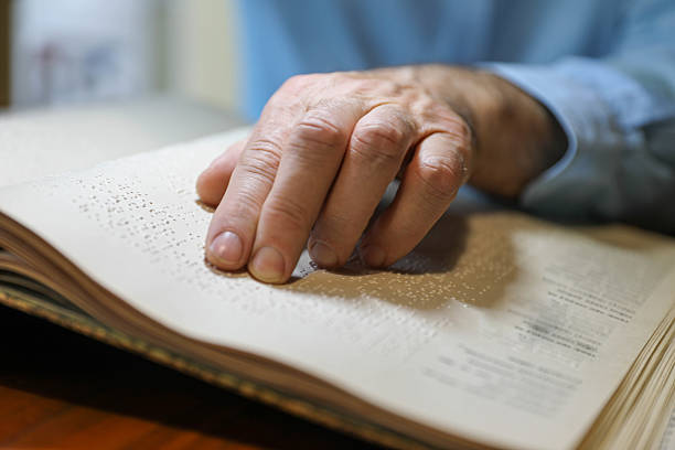 istock A Blind Man Over 50 Reading Braille Book 2208726274
