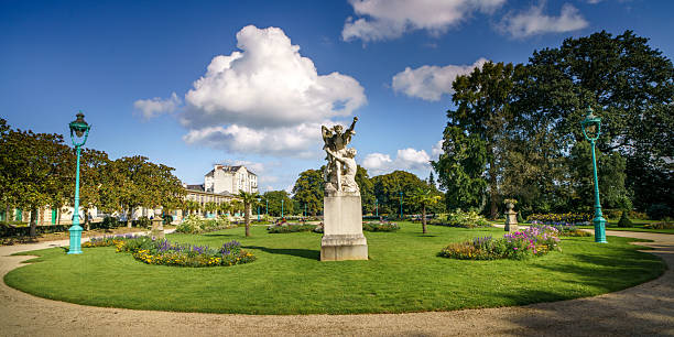 historical flowerpot with human head statue in castle garden