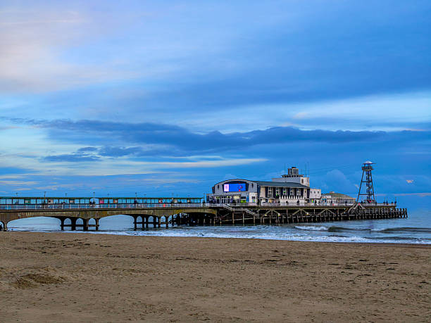 istock A pier with a building on it and a blue sky in the background 2208732149