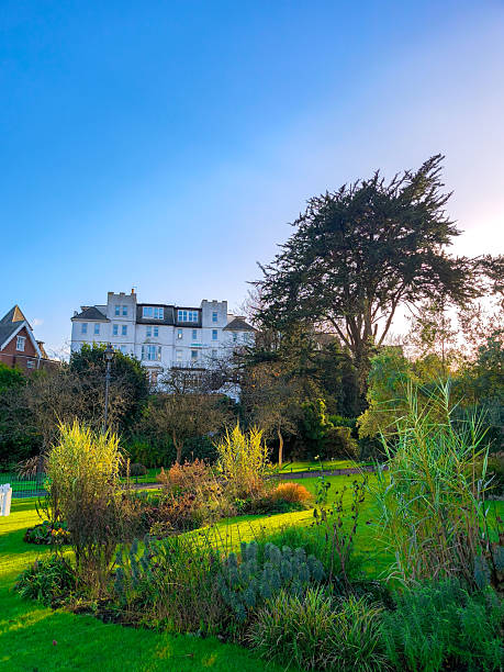 istock A beautiful garden with a large white building in the background 2208732254