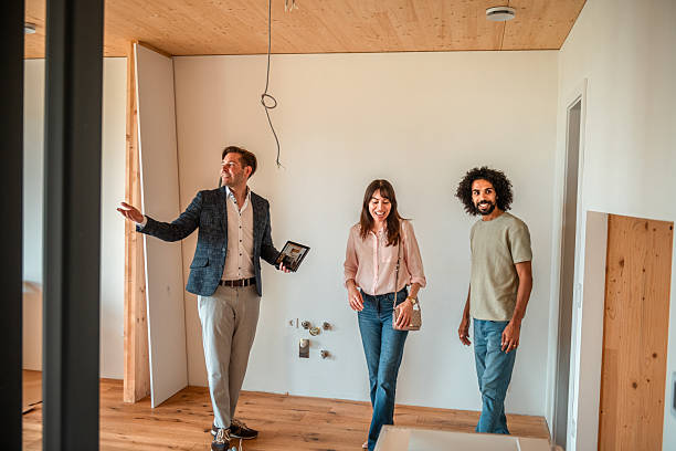 istock Diverse Team Reviews 3D Renovation Design on Tablet 2208733487