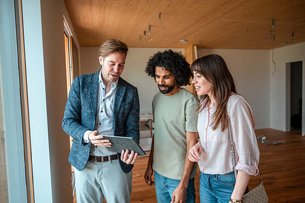 istock Diverse Team Reviews Digital Renovation Blueprint 2208733490