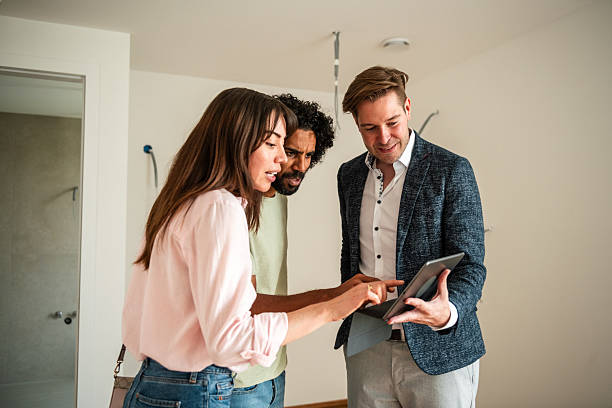 istock Diverse Team Reviewing Digital 3D Renovation Plans 2208733510