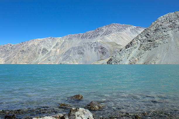The El Yeso Reservoir is an artificial reservoir of water stored through a dam located in the Andes Mountains.