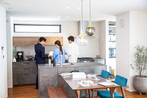 istock Housing sales: Salesman showing a model room, back view 2208765719