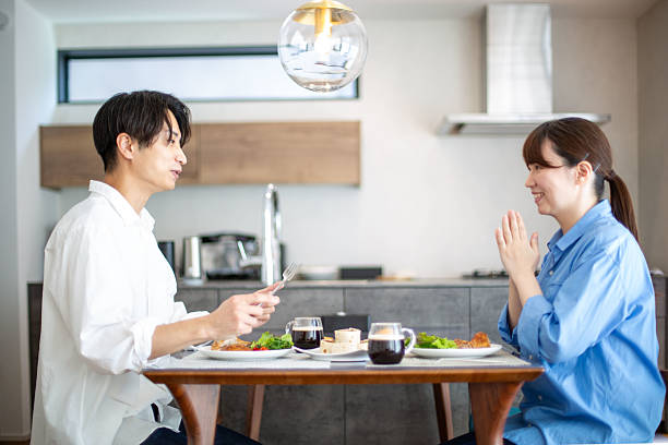 istock A young Japanese couple enjoying a holiday lunch 2208765809
