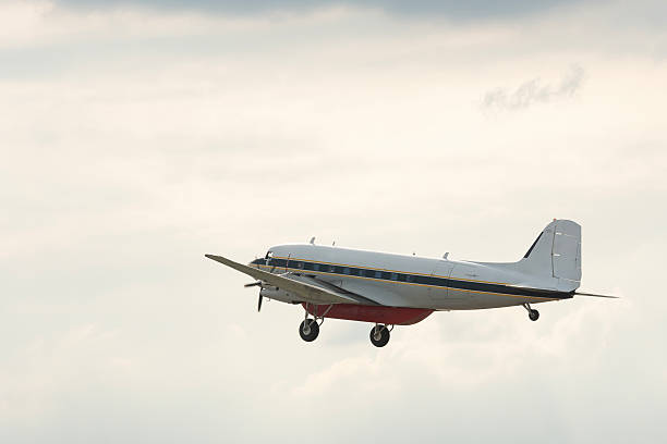 istock Military plane flying through the sky and clouds on nature background 2208767604