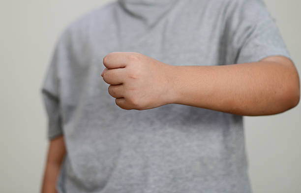 istock The child's hand is clenched into a fist. 2208768102