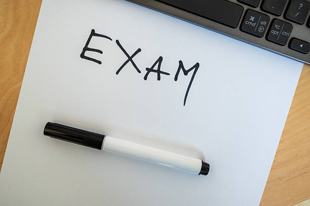 istock word exam written with black pen on paper 2208776688
