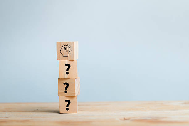 istock Concept of Artificial Intelligence with Wooden Blocks and Question Marks 2208779913