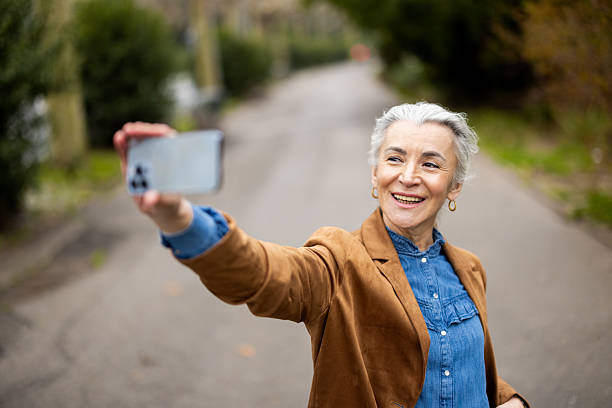 istock Senior woman on a journey taking a selfie 2208782166