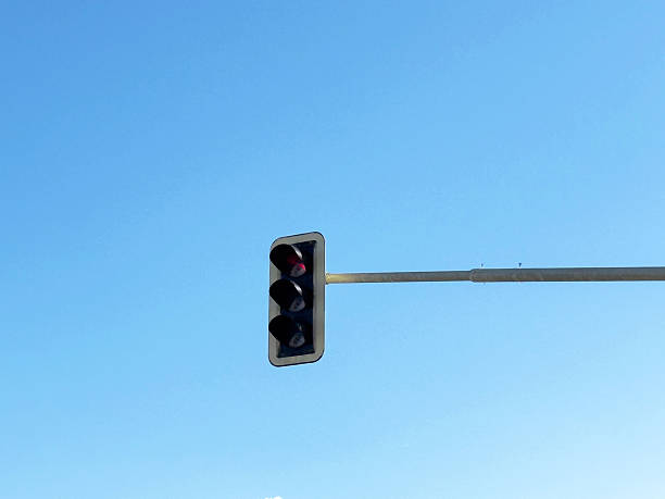 istock Minimalistic traffic light against clear blue sky 2208784326