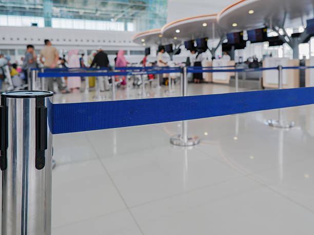 istock check in queue line tape at the airport airplane. 2208784739