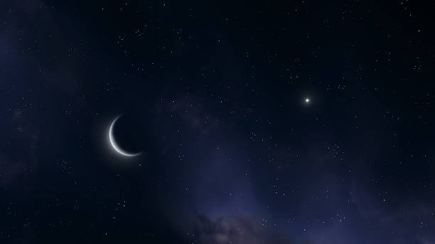 istock Crescent moon near planet Saturn in the night sky. 2208785137