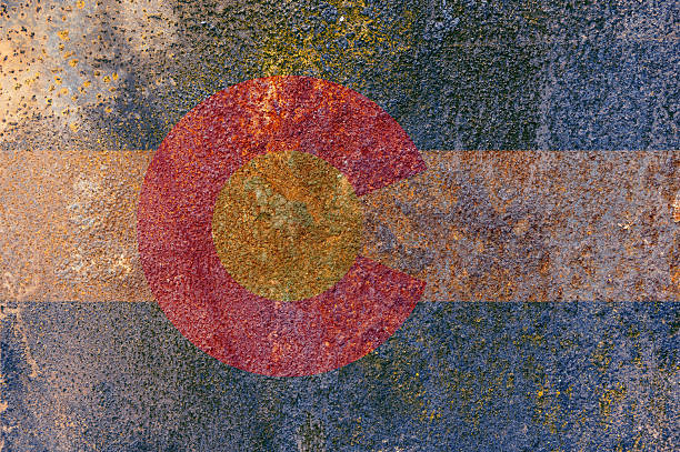 Colorado State Flag. Dirty Colorado state flag on rusty metal surface. Colorado State Flag. Dirty Colorado state flag on rusty metal surface. Rusty metal texture colorado flag art pictures stock pictures, royalty-free photos & images