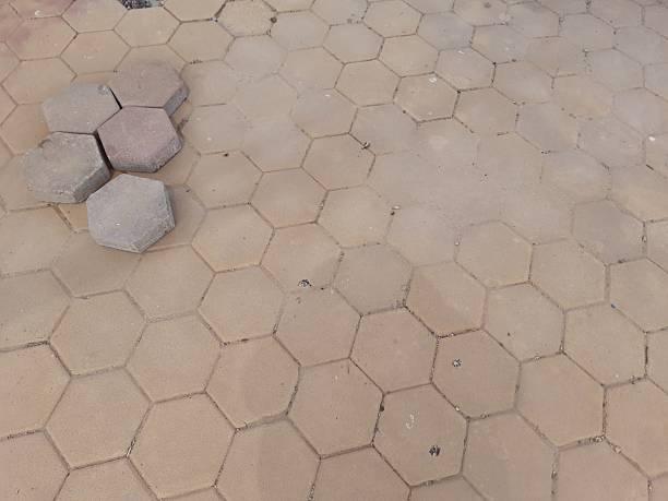 istock Five hexagonal cement tiles on a yellow hexagonal cement tile floor, backgrounds, copy space, yellow color 2208787841