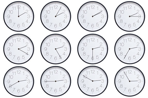 istock A set of twelve round wall clocks with dark brown frames and white faces showing 5-minute time intervals from 02:00 or 14:00 to 02:55 or 14:55. Clean white background, ideal for time, schedule, and deadline concepts. 2208789464