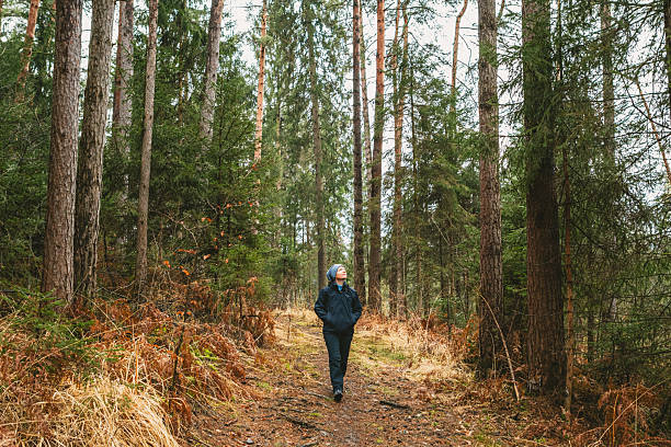 istock Woman Hiking In Early Spring Forest 2208790526