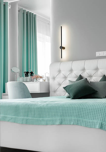 istock A minimalist elegant modern bedroom featuring a sleek bed, natural color tones, and a bright window overlooking an outdoor area. Interior Minimalist Design 2208791043