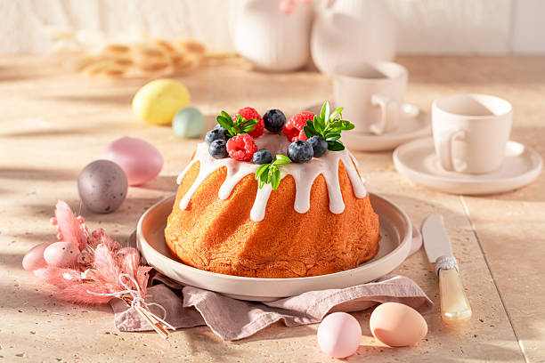 istock Homemade ring cake for Easter with lemon icing and fruit. 2208791840