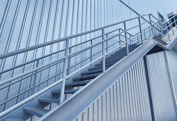 istock A set of stairs ascending a large blue wall 2208800998