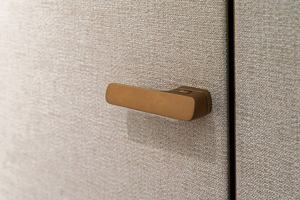istock Close-up of a matte gold door handle 2208801317