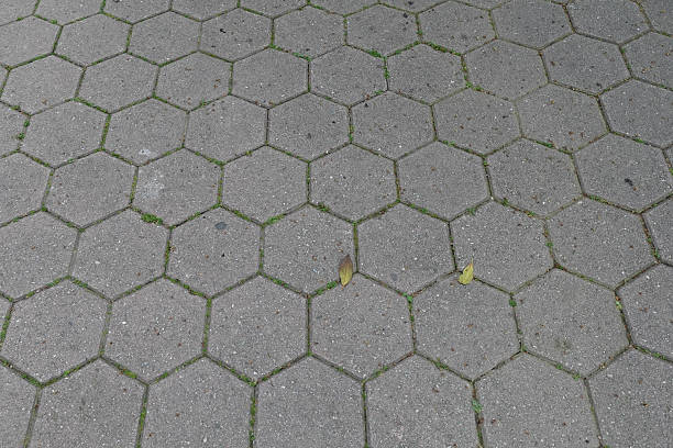 Hexagonal outdoor paving geometric shapes pattern on sidewalk tile. Background texture.