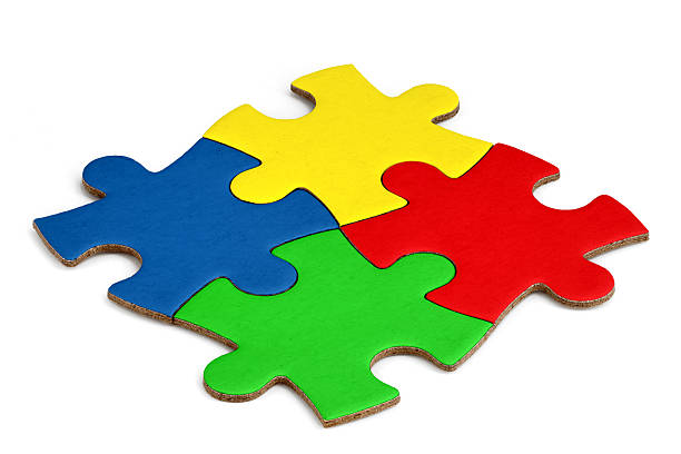istock Four assembled puzzle pieces in different colors on white background, concept for teamwork, creativity, logical thinking or problem solving 2208805037
