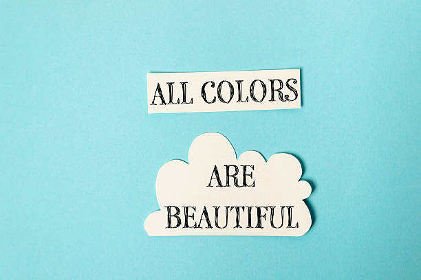 All colors are beautiful. This is a message of positivity and inclusivity. A blue background with a white cloud and a white
