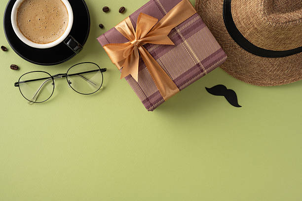 istock Flat lay image featuring a coffee cup, glasses, gift box, hat, and retro items celebrating fathers or men with gifting themes 2208807178